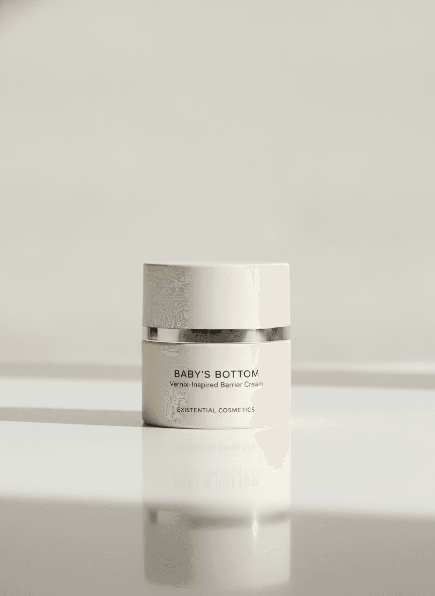 Baby's Bottom barrier cream: a low ivory airless pump jar with a short opaque cap and silver band