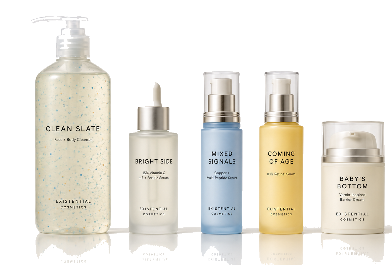 Five Existential Cosmetics skincare products photographed in warm white studio light